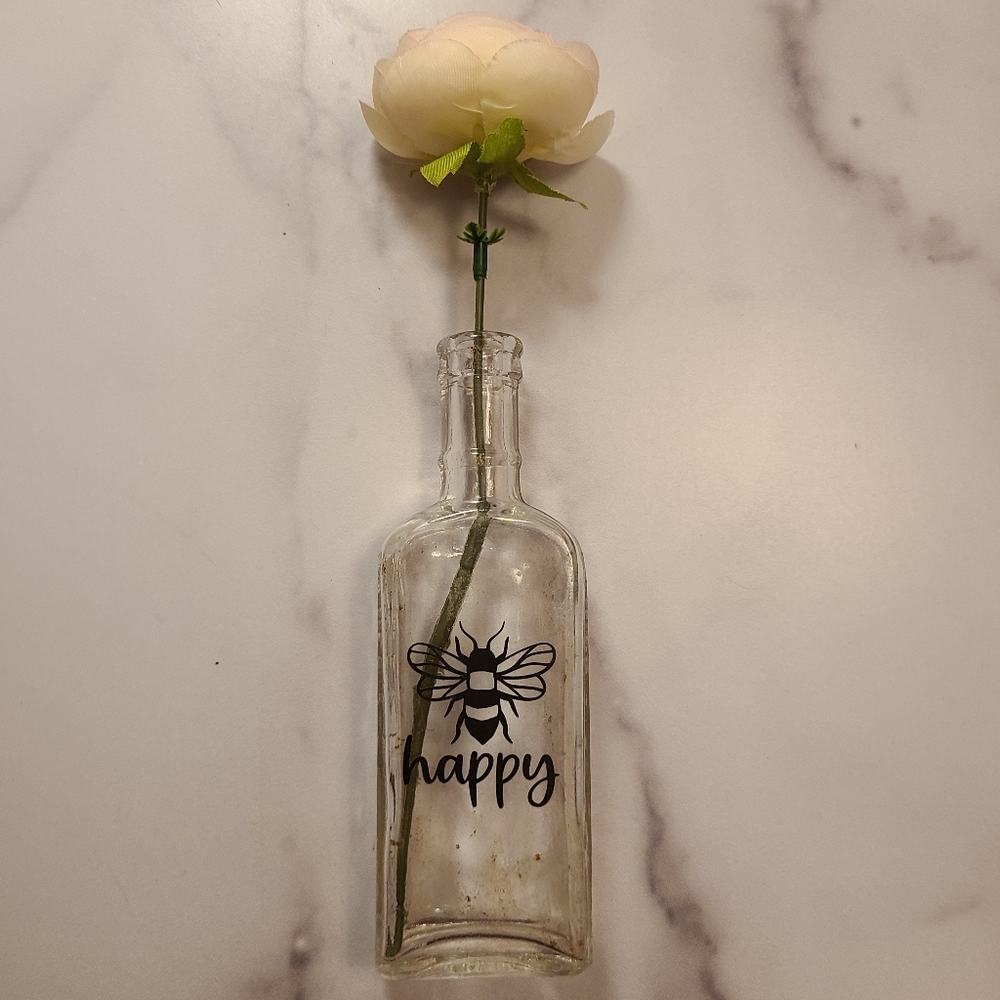Antique bottle with decorative vinyl.